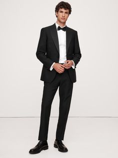 Exquisitely tailored, these timeless tuxedo pants offers elevated style that stands up to the seasons.  Made from Italian virgin wool, our designers employed a classic Barathea weave, classic faille side stripes and our tailored slim fit for a natural look that's especially polished.  Button tabs at the waist offer a customizable fit.  Tailored slim fit: Slim through the leg with a bit of extra length for a distinctive break at the hem.  Fabric from Italy's Marzotto mill.  Zip fly with button cl Classic Formal Tuxedo With Structured Boning, Classic Evening Tuxedo With Structured Boning, Classic Slim Fit Evening Suits, Luxury Tailored Dress Pants For Formal Occasions, Classic Tuxedo With Notch Lapel And Structured Boning, Classic Slim Fit Tuxedo With Pressed Crease, Classic Formal Dress Pants In Suiting Fabric, Timeless Formal Dress Pants With Pressed Crease, Elegant Wool Dress Pants For Formal Occasions