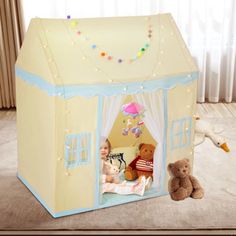 a child's play tent with teddy bears in it