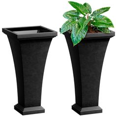 two black planters with plants in them on top of each other, one is tall and the other is short