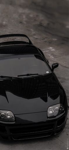 a black sports car parked on the street