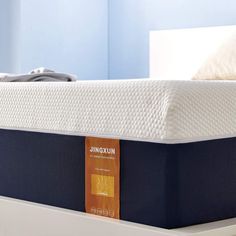 an unoxun mattress is sitting on top of a bed