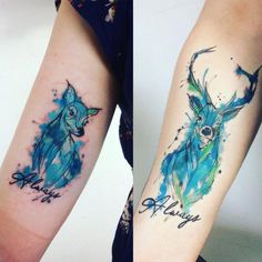 two tattoos that say happy and an image of a deer with horns on their arms