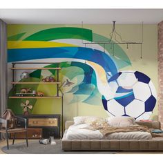 a bedroom with a soccer ball painted on the wall next to a bed and shelves