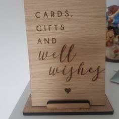 a wooden card holder that says cards, gifts and well wishes