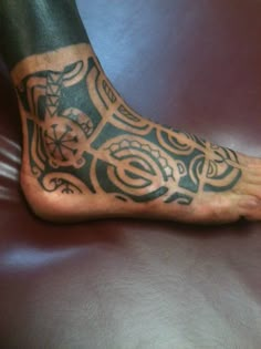 a person with a tattoo on their foot