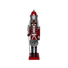 a nutcracker figurine is standing on a red base with a silver crown