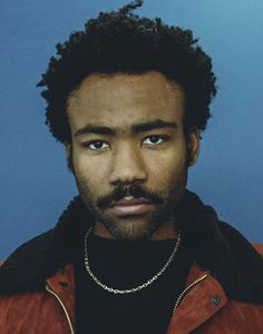 a close up of a person wearing a red jacket