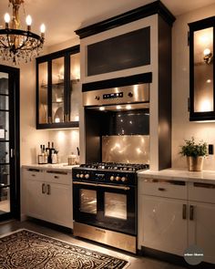 a black and white kitchen with an oven, stove, cabinets, rug and chandelier