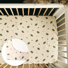 an overhead view of a crib with a baby's bed in the middle