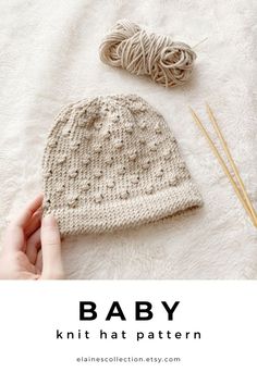 a knitted hat and knitting needles on a white blanket with text overlay that reads, baby knit hat pattern