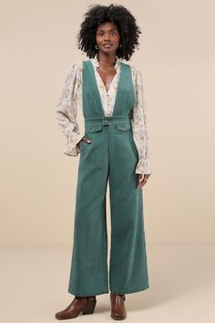 It's easy to become a layering expert when you have a perfect piece like the Lulus Autumn Energy Green Corduroy Wide-Leg Overall Jumpsuit! This sturdy woven corduroy jumpsuit has an overall-inspired design that will pair seamlessly with all your favorite turtlenecks. The sleeveless bodice features a plunging V-neckline and wide shoulder straps, atop a banded waist with a brown button closure and a hidden zip fly. Trendy wide legs boast decorative flap pockets (with matching brown buttons), convenient side seam pockets, and ankle-length hems. Fit: This garment fits true to size. Length: Floor length. Size medium measures 57" from shoulder to hem. Inseam: 29.00 Front Rise: 14.50 Bust: Great for any cup size. Waist: Fitted - very fitted at natural waist. Hip: Loosely Fitted. Fabric: Fabric ha Dark Academia Jumpsuit, Fall Corduroy Overalls For Workwear, Fall Corduroy Workwear Overalls, Corduroy Overalls For Workwear, Autumn Jumpsuit, Retro Overalls, 70s Jumpsuit, Corduroy Jumpsuit, Fun Dresses