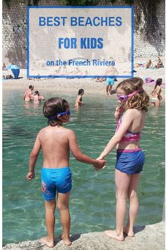 two young children standing in the water near a sign that says best beaches for kids on the french riviera