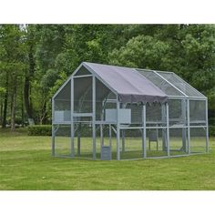 a chicken coop in the middle of a field