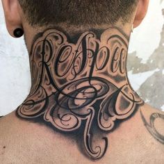 the back of a man's neck is covered with tattoos and letters that spell, reboot