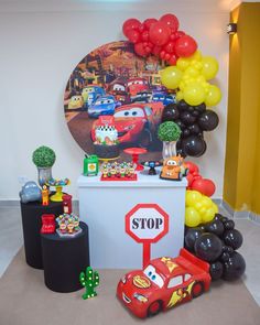 a birthday party with cars balloons and decorations