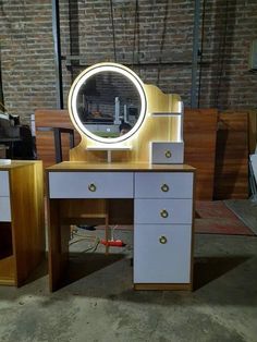 a desk with a lighted mirror on it