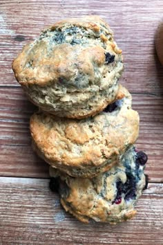 three blueberry muffins stacked on top of each other