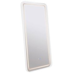 a white mirror sitting on top of a table