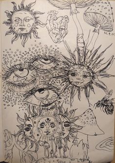 a drawing on paper with an eye in the center and other drawings around it,