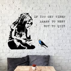 there is a wall sticker with a girl and a bird on it that says if you get tired, learn to rest not to quitt