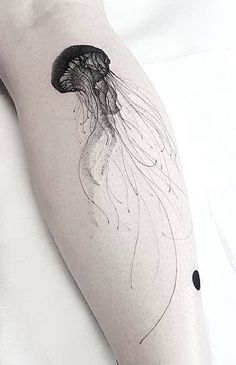 a black and white photo of a jellyfish tattoo