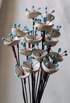 a vase filled with blue and white flowers