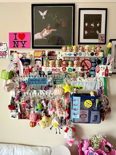 there is a wall full of toys and pictures