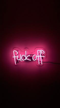 a neon sign that says f k off on it