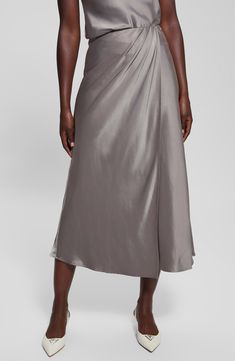 Soft pleats texture this wrapped maxi skirt elevated in luxe satin. 36 1/2" length Side zip closure Unlined 58% recycled polyester, 42% polyester Hand wash, line dry Imported Chic Long Silk Wrap Skirt, Formal Silk Midi Skirt, Elegant Silk Wrap Skirt For Spring, Silk Wrap Skirt For Evening, Asymmetrical Silk Pleated Maxi Skirt, Elegant Pleated Wrap Skirt For Evening, Elegant Silk Pleated Maxi Skirt, Elegant Evening Pleated Wrap Skirt, Chic Silk Maxi Skirt With Satin Finish