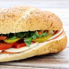 a close up of a sandwich on a wooden table