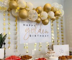 a birthday party with balloons and desserts