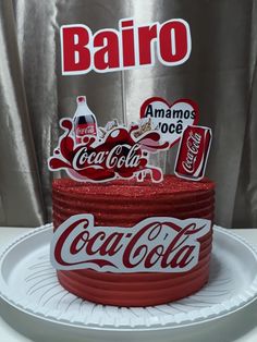 the cake is decorated with coca - cola's logo and other things on it