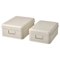 two white storage boxes sitting next to each other