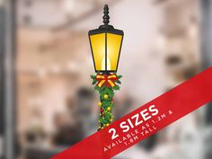 a street light with christmas decorations on it and the words 2 sizes available at them