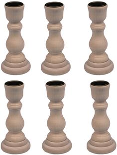 a set of six wooden candlesticks sitting next to each other on a white background