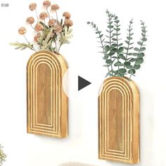 two wooden vases with flowers in them on a wall next to a planter