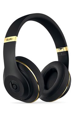 the beats on ear headphones are black and gold