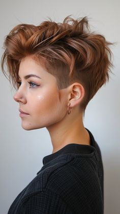 This iconic short hairstyle has been a favorite among women who crave a fresh, confident, and stylish look. Pixie cuts are not only incredibly chic but also versatile, allowing you to express your unique personality Short Side Shaved Hairstyles For Women, How To Style A Faux Hawk Pixie, Assymetrical Pixie Shaved Side, Short Punk Hairstyle Women, Pixie Hair Women, Short Hair Styles Pixie Undercut, Mowhak Hairstyle Female, Butch Haircuts Women, Short Edgy Pixie Cuts Shaved Sides