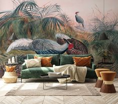 a living room filled with furniture and wall murals