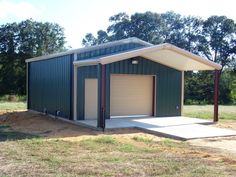 two garages in the middle of an open field