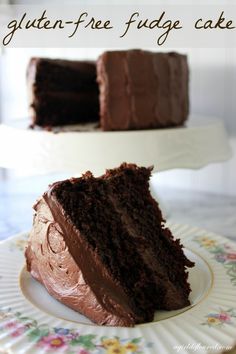 a slice of chocolate cake on a plate with the text gluten - free fudge cake