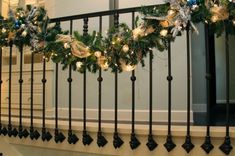 christmas wreaths on the railing of a house