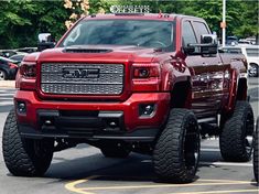 a red truck parked in a parking lot