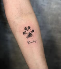 a dog paw with the word ruby written on it's left forearm and foot