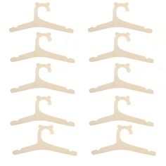 six white plastic hangers on a white background