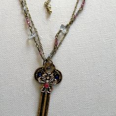 This Necklace Is Handcrafted With Two Strands Of Brass Chain. One Has Blue Gray Stone Chips And Rose Pink Beads On It While The Other Is A Cable Chain. The Brass Key Pendant Has Blue And Pink Crystals On The Front With Silver Toned Accents. The Key Is 2 18" Long X 1" Wide. The Necklace Itself Is 19" Long And Can Be Extended Another 3" And Has A Lobster Claw Clasp. It Is Is Very Light And Victorian Looking And Can Be Dressed Up Or Down. My Jewelry Is One Of A Kind And Handcrafted And Arrives In A Key Jewelry Diy, Vintage Key Necklaces As Gift, Vintage Key Necklace Jewelry, Vintage Metal Jewelry With Keys, Key Crafts, Jewelry Making Business, Skeleton Key Necklace, Skeleton Key Necklace Vintage, Key Jewelry