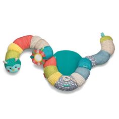 a toy snake is laying on the ground next to it's head and tail