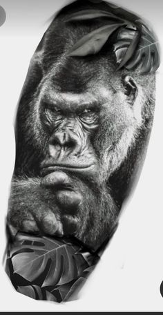 a man's arm with a gorilla tattoo on it