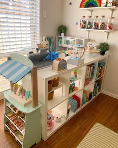 a child's playroom with shelves and toys