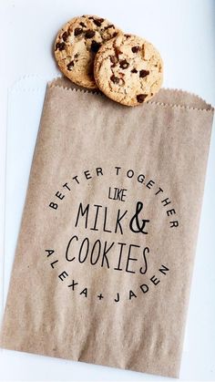 two cookies sitting on top of a brown paper bag next to each other with the words better together like milk and cookies printed on it